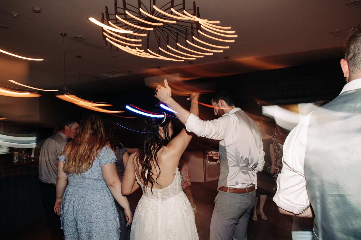 wedding-party-and-bride-and-groom-dance-on-cayuga-lake-in-the-finger-lakes-ny