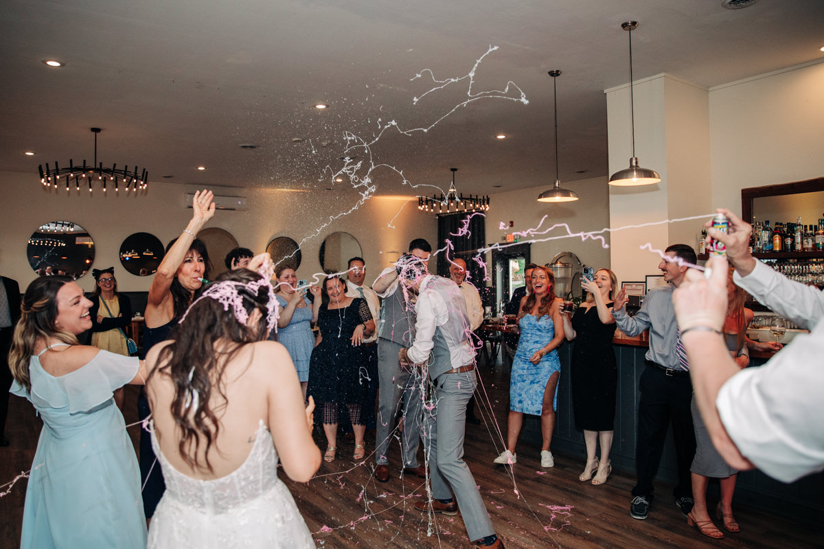 wedding-party-and-bride-and-groom-dance-on-cayuga-lake-in-the-finger-lakes-ny