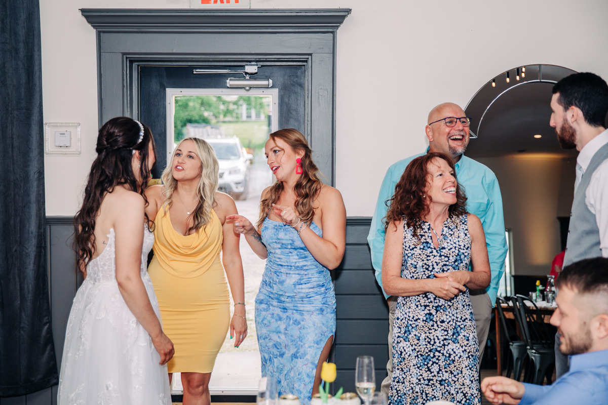 wedding-party-and-bride-and-groom-dance-on-cayuga-lake-in-the-finger-lakes-ny