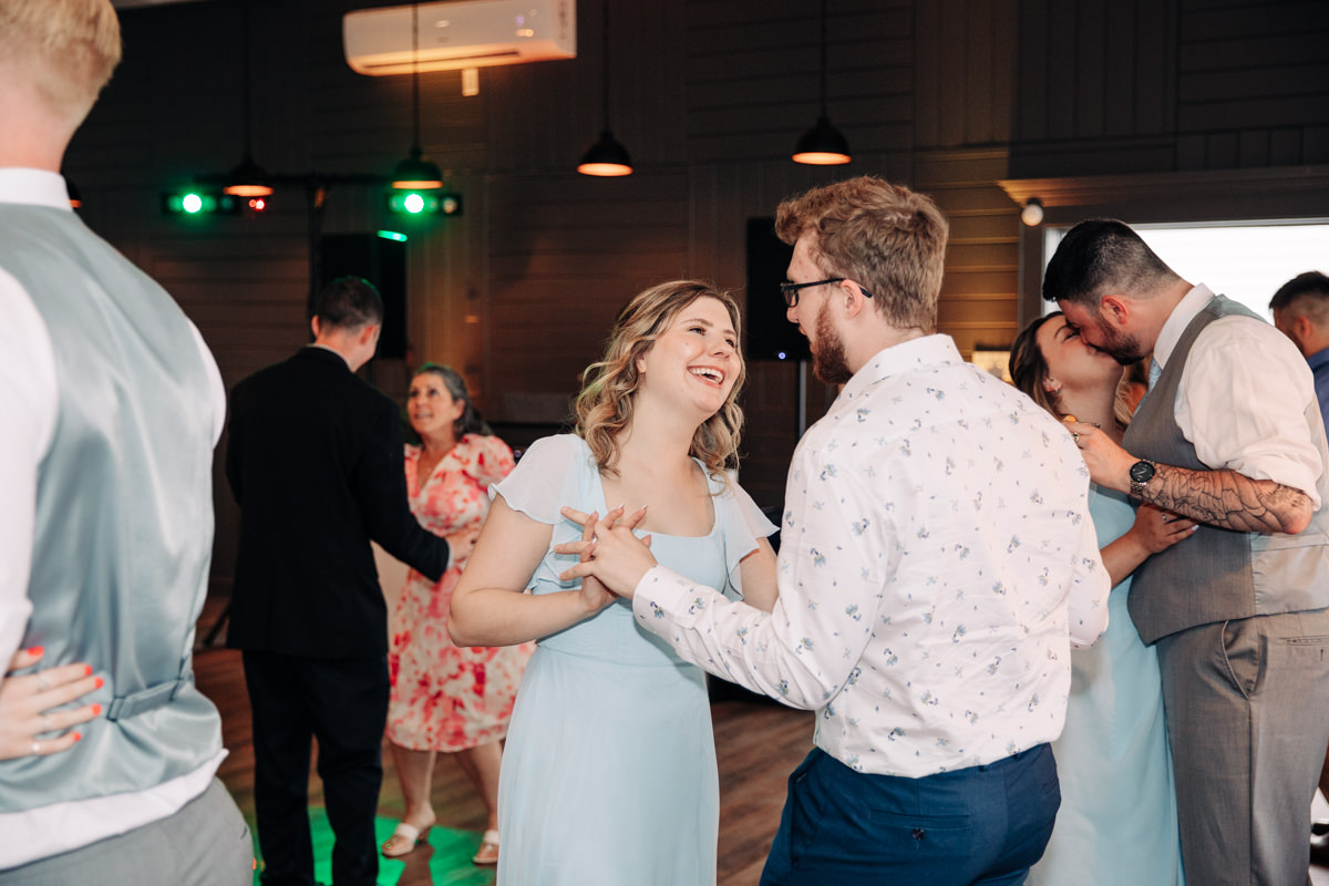 wedding-party-and-bride-and-groom-dance-on-cayuga-lake-in-the-finger-lakes-ny