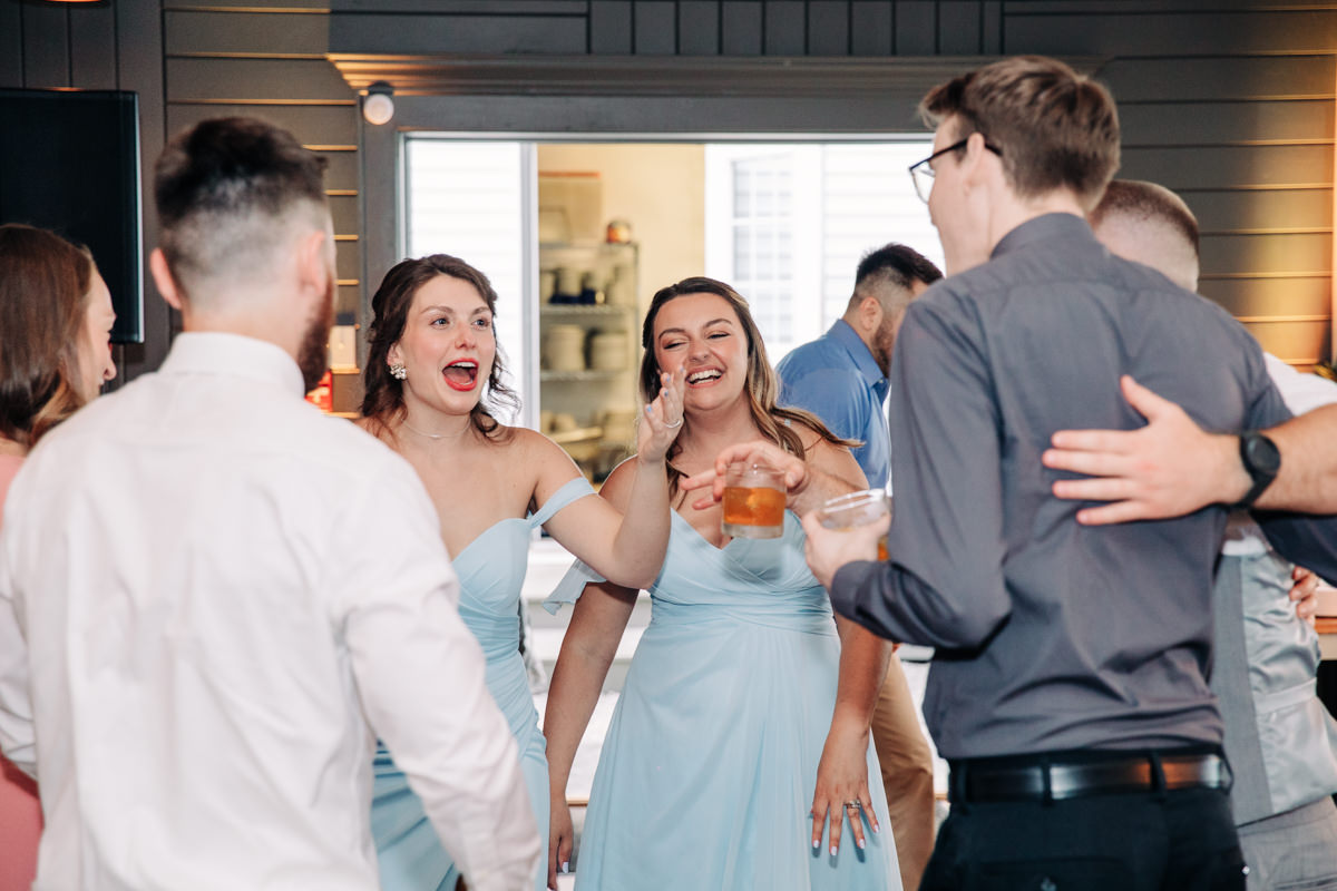 wedding-party-and-bride-and-groom-dance-on-cayuga-lake-in-the-finger-lakes-ny