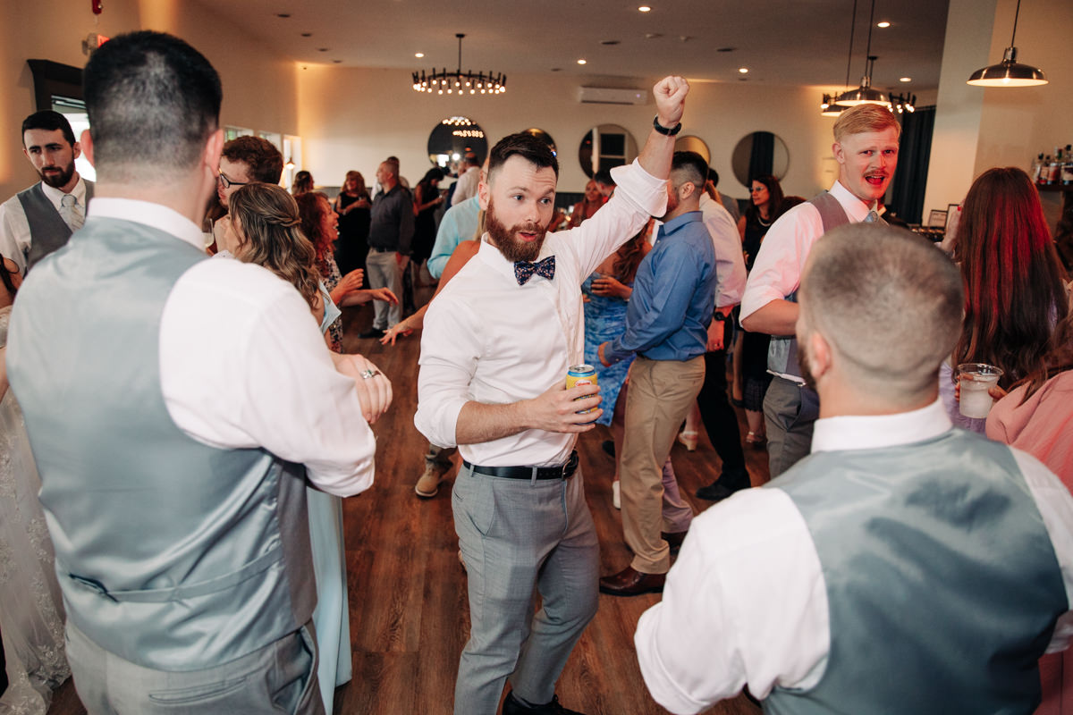 wedding-party-and-bride-and-groom-dance-on-cayuga-lake-in-the-finger-lakes-ny